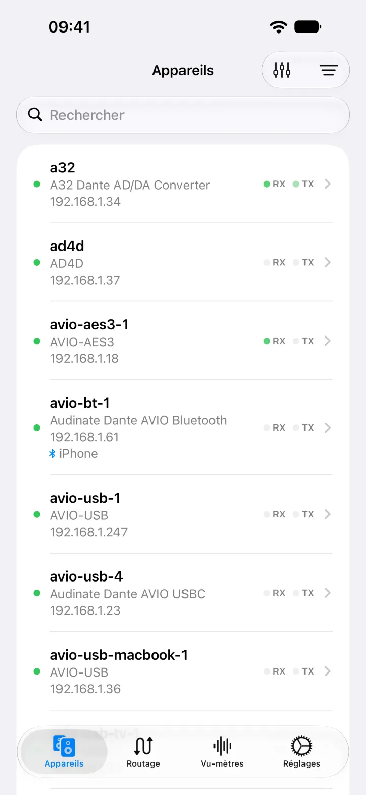 NetAudio sur iPhone listant des appareils Dante, dont un Ferrofish A32 et un Shure AD4D, avec le modèle et l’adresse de chacun.